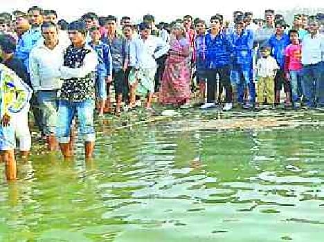  three friends immersed in Sarayu 